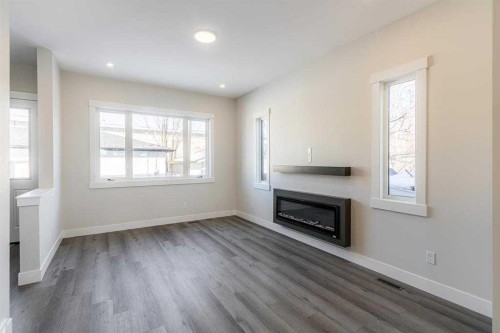 2526 4 Avenue Nw, Calgary, AB - Indoor Photo Showing Living Room With Fireplace