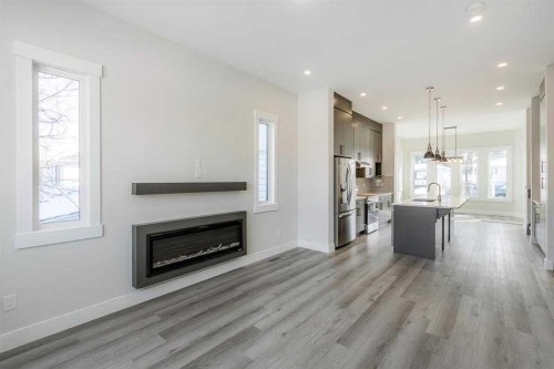 2526 4 Avenue Nw, Calgary, AB - Indoor Photo Showing Living Room With Fireplace