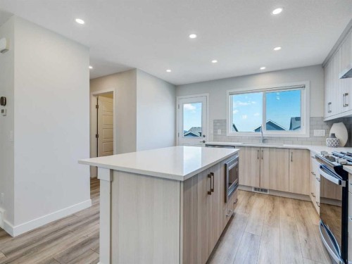 235 Aquila Way Nw, Calgary, AB - Indoor Photo Showing Kitchen With Upgraded Kitchen