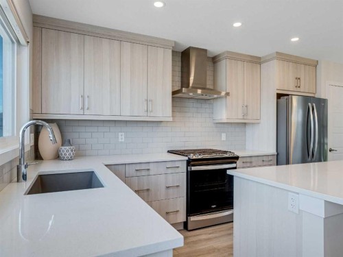 235 Aquila Way Nw, Calgary, AB - Indoor Photo Showing Kitchen With Upgraded Kitchen