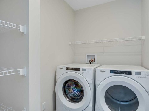 235 Aquila Way Nw, Calgary, AB - Indoor Photo Showing Laundry Room