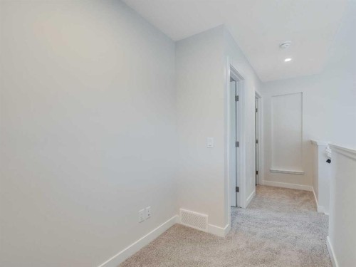 235 Aquila Way Nw, Calgary, AB - Indoor Photo Showing Other Room