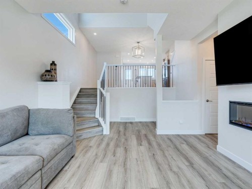 235 Aquila Way Nw, Calgary, AB - Indoor With Fireplace