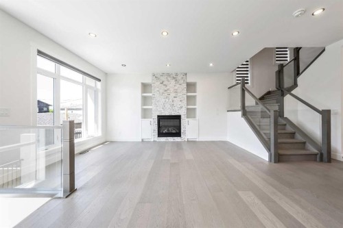 4923 20 Avenue Nw, Calgary, AB - Indoor Photo Showing Other Room With Fireplace