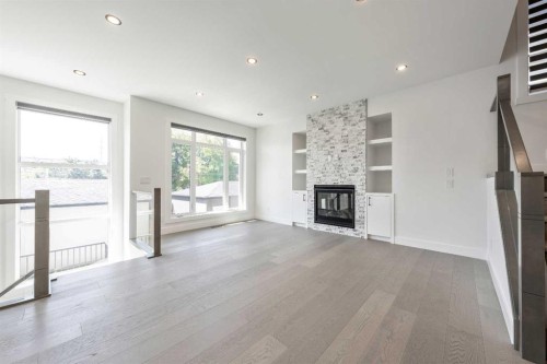 4923 20 Avenue Nw, Calgary, AB - Indoor Photo Showing Living Room With Fireplace