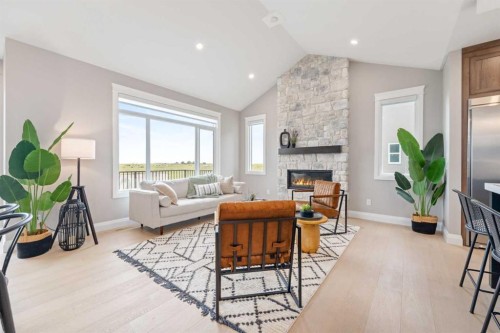 33 North Bridges Landing, Langdon, AB - Indoor Photo Showing Living Room With Fireplace