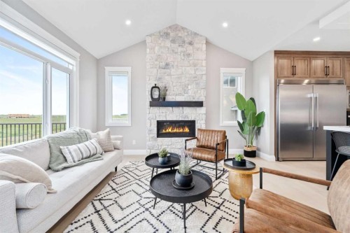 33 North Bridges Landing, Langdon, AB - Indoor Photo Showing Living Room With Fireplace