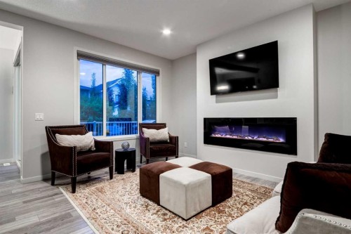 19 West Grove Place Sw, Calgary, AB - Indoor Photo Showing Living Room With Fireplace