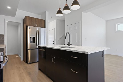 1514 25 Street, Didsbury, AB - Indoor Photo Showing Kitchen With Double Sink