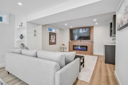 2003 Christie Road Nw, Calgary, AB - Indoor Photo Showing Living Room With Fireplace