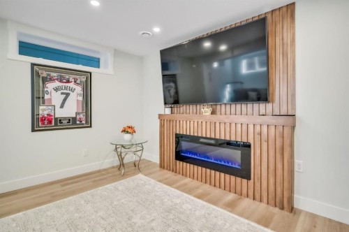 2003 Christie Road Nw, Calgary, AB - Indoor Photo Showing Living Room With Fireplace