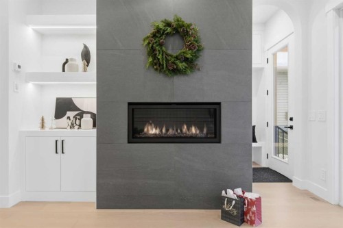 646 25 Avenue Nw, Calgary, AB - Indoor Photo Showing Other Room With Fireplace