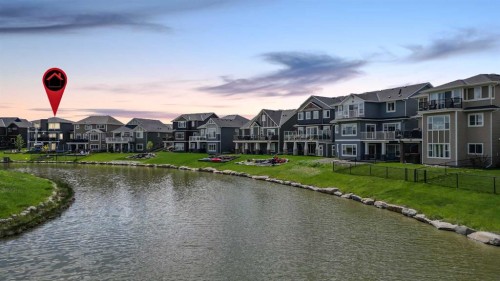 1343 Bayside Drive Sw, Airdrie, AB - Outdoor With Body Of Water With Facade
