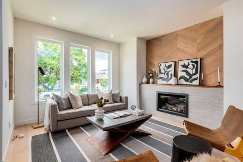 1612 16A Street Se, Calgary, AB - Indoor Photo Showing Living Room With Fireplace