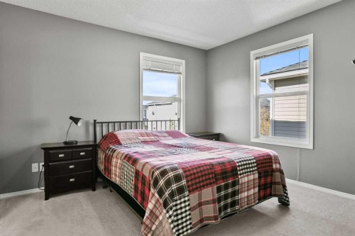 701 Prairie Sound Circle Nw, High River, AB - Indoor Photo Showing Bedroom