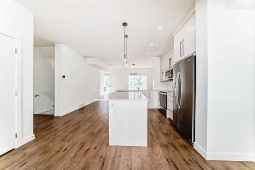 605-335 Creekside Boulevard Sw, Calgary, AB - Indoor Photo Showing Kitchen With Stainless Steel Kitchen