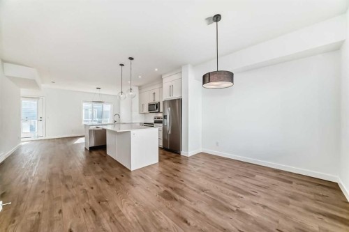 605-335 Creekside Boulevard Sw, Calgary, AB - Indoor Photo Showing Kitchen With Upgraded Kitchen