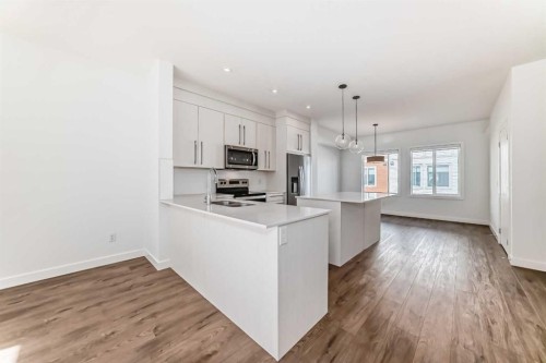 605-335 Creekside Boulevard Sw, Calgary, AB - Indoor Photo Showing Kitchen With Upgraded Kitchen