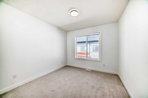 605-335 Creekside Boulevard Sw, Calgary, AB - Indoor Photo Showing Other Room