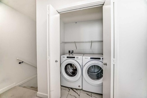 605-335 Creekside Boulevard Sw, Calgary, AB - Indoor Photo Showing Laundry Room