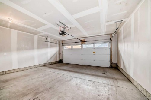 605-335 Creekside Boulevard Sw, Calgary, AB - Indoor Photo Showing Garage