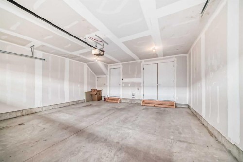 605-335 Creekside Boulevard Sw, Calgary, AB - Indoor Photo Showing Garage