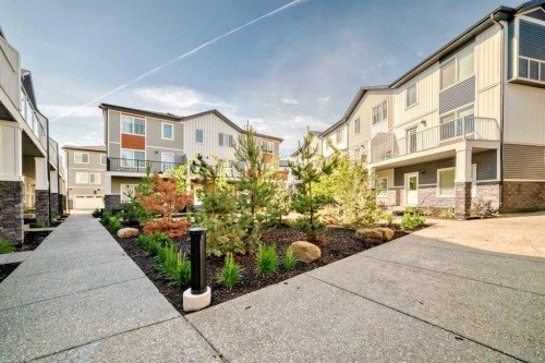 605-335 Creekside Boulevard Sw, Calgary, AB - Outdoor With Balcony With Facade