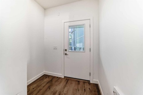 605-335 Creekside Boulevard Sw, Calgary, AB - Indoor Photo Showing Other Room