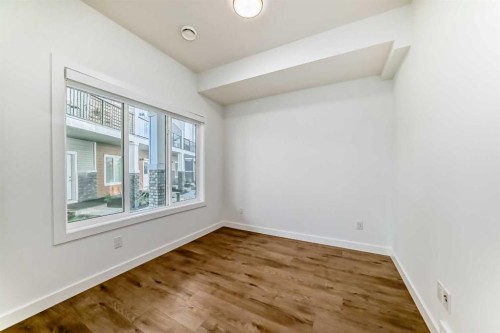605-335 Creekside Boulevard Sw, Calgary, AB - Indoor Photo Showing Other Room