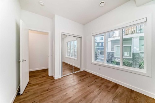605-335 Creekside Boulevard Sw, Calgary, AB - Indoor Photo Showing Other Room