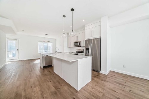 605-335 Creekside Boulevard Sw, Calgary, AB - Indoor Photo Showing Kitchen With Upgraded Kitchen