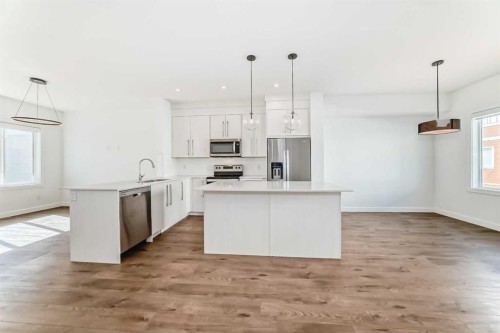 605-335 Creekside Boulevard Sw, Calgary, AB - Indoor Photo Showing Kitchen With Stainless Steel Kitchen With Upgraded Kitchen