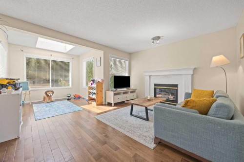71 Somercrest Close Sw, Calgary, AB - Indoor Photo Showing Living Room With Fireplace