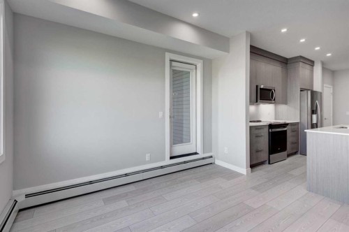 2215-6 Merganser Drive West, Chestermere, AB - Indoor Photo Showing Kitchen With Upgraded Kitchen