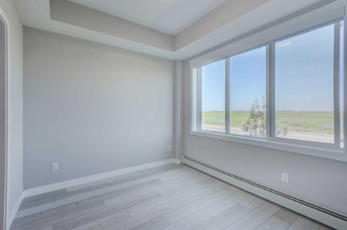 2215-6 Merganser Drive West, Chestermere, AB - Indoor Photo Showing Other Room