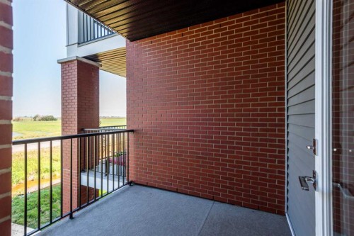 2215-6 Merganser Drive West, Chestermere, AB - Outdoor With Balcony With Exterior