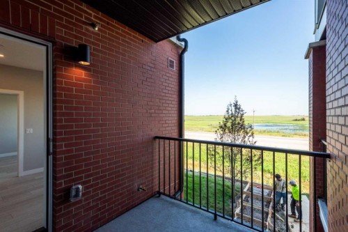 2215-6 Merganser Drive West, Chestermere, AB - Outdoor With Balcony With Exterior