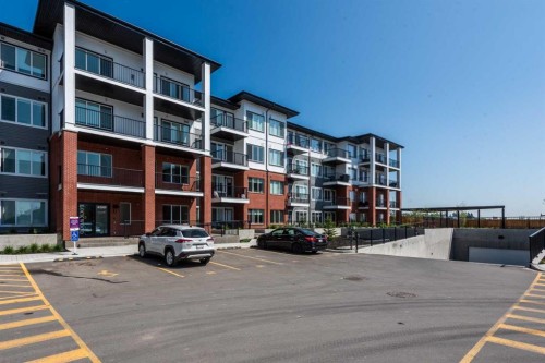 2215-6 Merganser Drive West, Chestermere, AB - Outdoor With Balcony With Facade