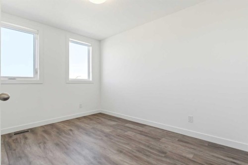 203-24 Rivercrest Drive, Cochrane, AB - Indoor Photo Showing Other Room