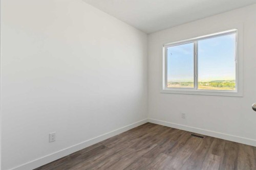 203-24 Rivercrest Drive, Cochrane, AB - Indoor Photo Showing Other Room