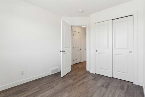 203-24 Rivercrest Drive, Cochrane, AB - Indoor Photo Showing Other Room