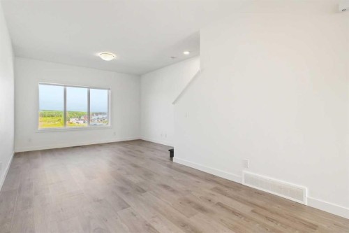 203-24 Rivercrest Drive, Cochrane, AB - Indoor Photo Showing Other Room