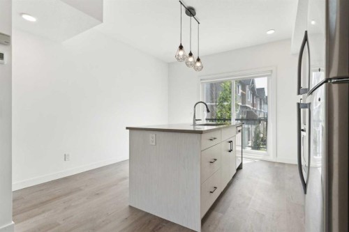 203-24 Rivercrest Drive, Cochrane, AB - Indoor Photo Showing Kitchen