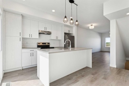 203-24 Rivercrest Drive, Cochrane, AB - Indoor Photo Showing Kitchen With Upgraded Kitchen