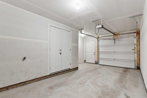 203-24 Rivercrest Drive, Cochrane, AB - Indoor Photo Showing Garage