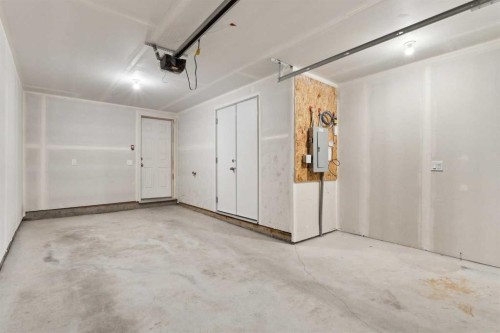 203-24 Rivercrest Drive, Cochrane, AB - Indoor Photo Showing Garage