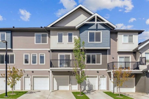 203-24 Rivercrest Drive, Cochrane, AB - Outdoor With Facade