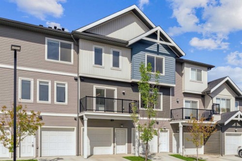 203-24 Rivercrest Drive, Cochrane, AB - Outdoor With Facade