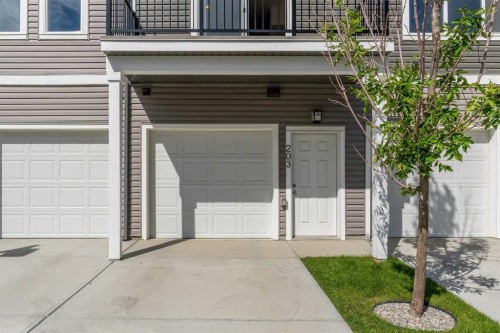 203-24 Rivercrest Drive, Cochrane, AB - Outdoor With Facade