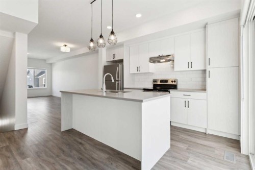 703-24 Rivercrest Drive, Cochrane, AB - Indoor Photo Showing Kitchen With Upgraded Kitchen